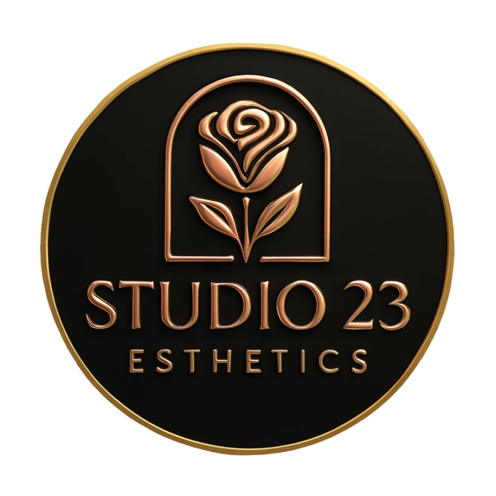 Circular Studio 23 Esthetics logo with a gold rose emblem and refined lettering on a transparent background, representing luxury skincare, makeup, lash, and waxing services in Farmington, New Mexico.