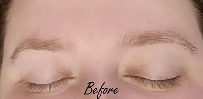 Before eyebrow enhancement showing lighter, less defined natural brows prior to professional eyebrow shaping and enhancement services at Studio 23 Esthetics.